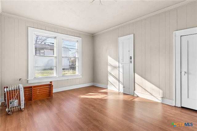 1202 S 7th St, Temple, TX 76504 - unfurnished room with healthy amount of natural light, wood finished floors, crown molding, and baseboards