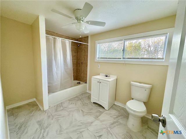 full bathroom with vanity, toilet, ceiling fan, and shower / tub combo with curtain