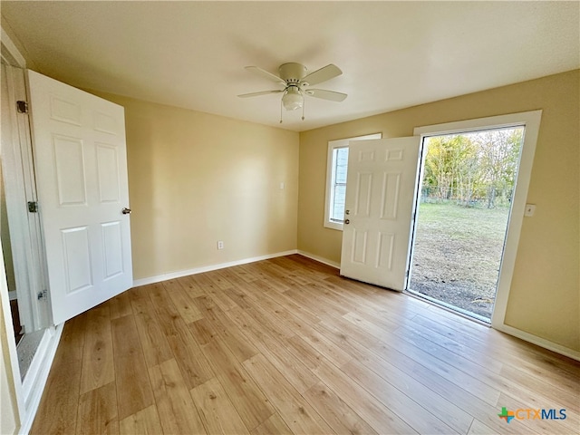 entrance foyer with ceiling fan and light hardwood / wood-style flooring