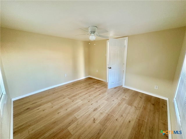 empty room with light hardwood / wood-style flooring and ceiling fan