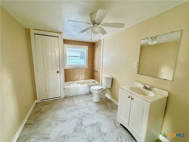 full bathroom with tiled shower / bath combo, ceiling fan, toilet, and vanity