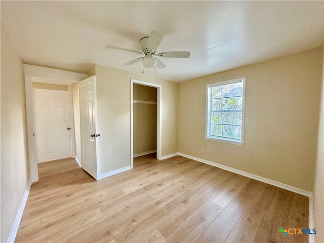 unfurnished bedroom featuring ceiling fan and light hardwood / wood-style floors