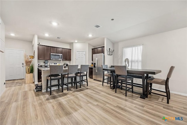 8919 Cantera Ridge Rd, Temple, TX 76502 - dining area featuring light wood finished floors and recessed lighting