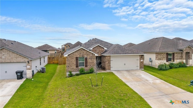 8919 Cantera Ridge Rd, Temple, TX 76502 - view of front facade with driveway, brick siding, and a garage