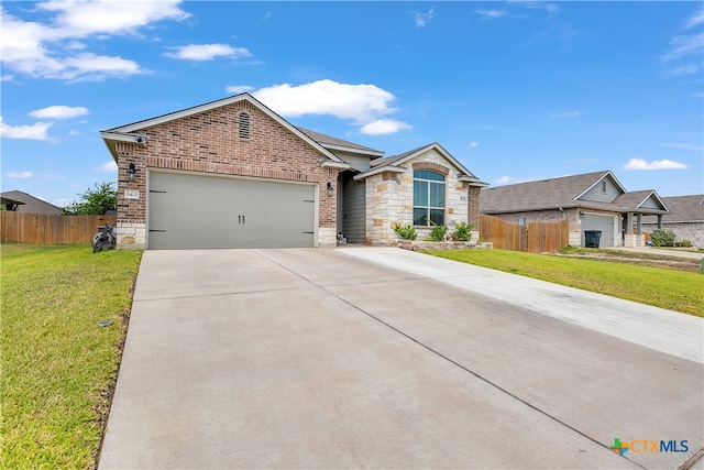 view of front of home featuring a garage and a front yard