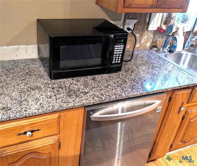 interior details featuring dishwasher and sink