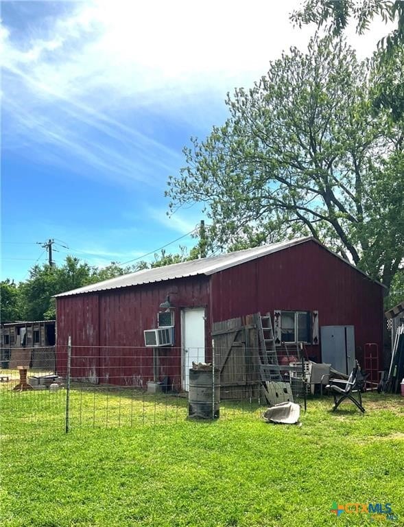 view of outdoor structure with a lawn