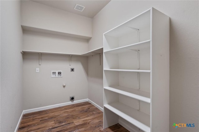 3903 Scenic Trail Dr, Harker Heights, TX 76548 - washroom with hookup for an electric dryer, washer hookup, gas dryer hookup, wood finished floors, and baseboards
