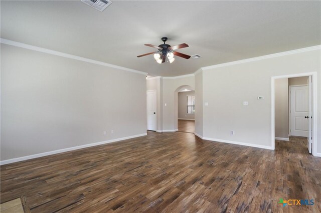 3903 Scenic Trail Dr, Harker Heights, TX 76548 - spare room with a ceiling fan, arched walkways, ornamental molding, dark wood-style flooring, and baseboards