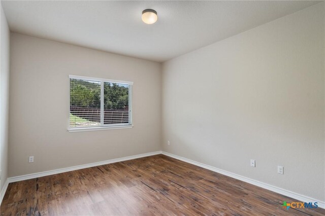 3903 Scenic Trail Dr, Harker Heights, TX 76548 - empty room with wood finished floors and baseboards