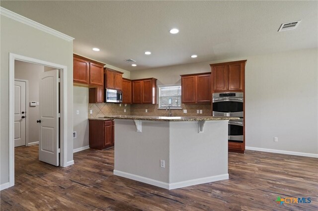 3903 Scenic Trail Dr, Harker Heights, TX 76548 - kitchen featuring stainless steel appliances, decorative backsplash, dark wood-type flooring, light stone countertops, and recessed lighting