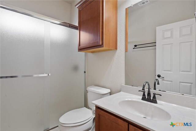 3903 Scenic Trail Dr, Harker Heights, TX 76548 - bathroom featuring a stall shower, vanity, and toilet