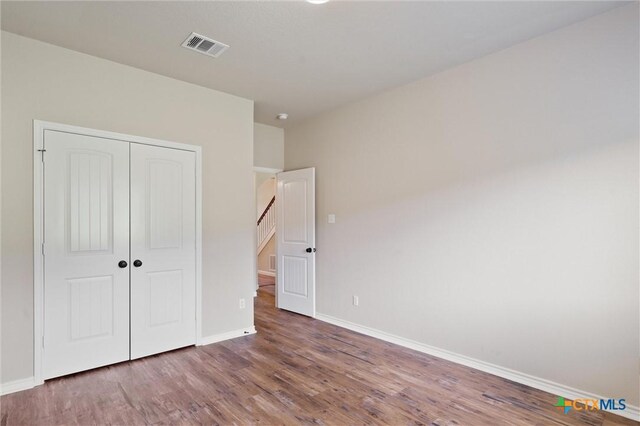 3903 Scenic Trail Dr, Harker Heights, TX 76548 - unfurnished bedroom with wood finished floors, baseboards, and a closet