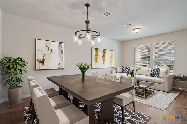 3903 Scenic Trail Dr, Harker Heights, TX 76548 - dining area featuring a chandelier, wood finished floors, and baseboards