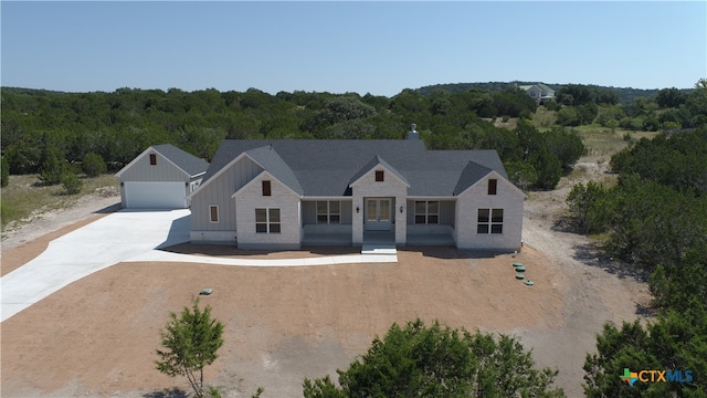 modern farmhouse style home with a garage