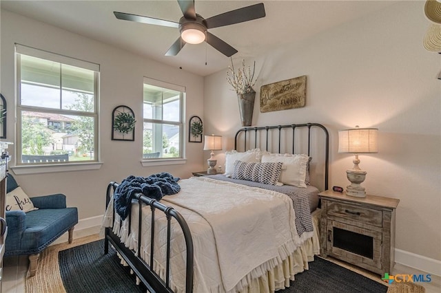 1308 Dancing Oak Ln, San Marcos, TX 78666 - bedroom featuring a ceiling fan and wood finished floors