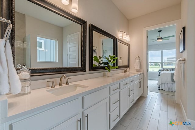 1308 Dancing Oak Ln, San Marcos, TX 78666 - full bath featuring double vanity, a ceiling fan, and ensuite bathroom