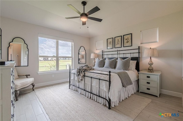 1308 Dancing Oak Ln, San Marcos, TX 78666 - bedroom featuring light wood finished floors and ceiling fan
