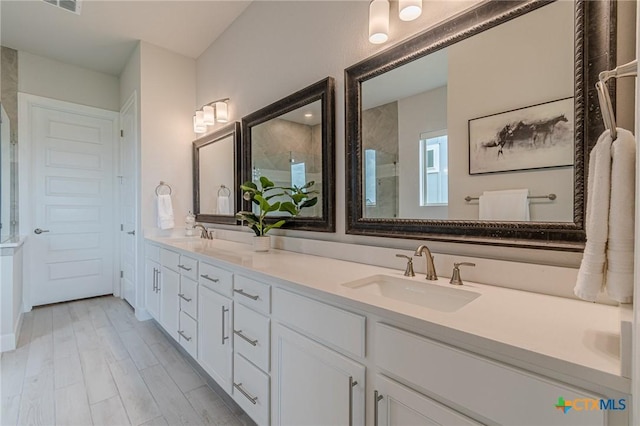 1308 Dancing Oak Ln, San Marcos, TX 78666 - bathroom with double vanity and a tile shower