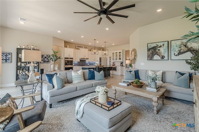 1308 Dancing Oak Ln, San Marcos, TX 78666 - living room featuring ceiling fan, recessed lighting, and light wood-style floors