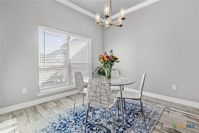 dining space with ornamental molding and an inviting chandelier