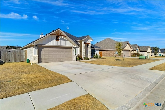 view of front of house with a front yard and a garage