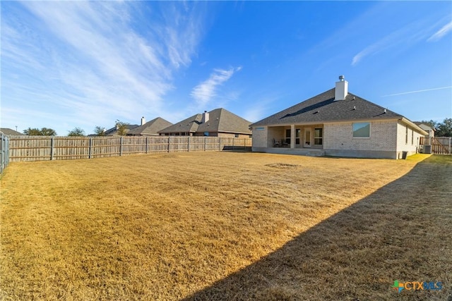 view of yard featuring a patio area and central AC