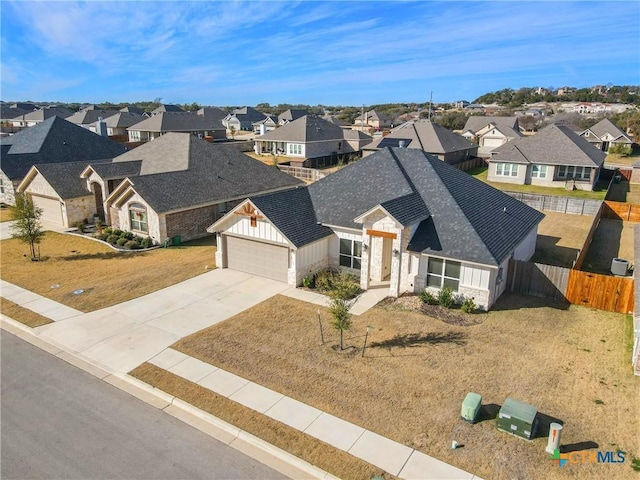 view of front of property featuring a garage and a front lawn