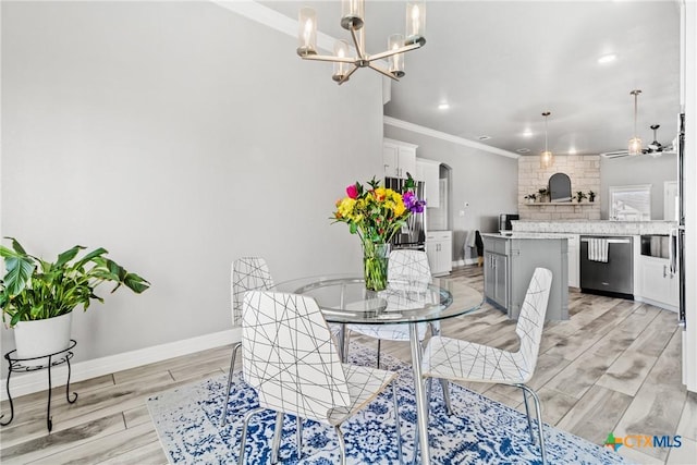 dining space with a chandelier and crown molding