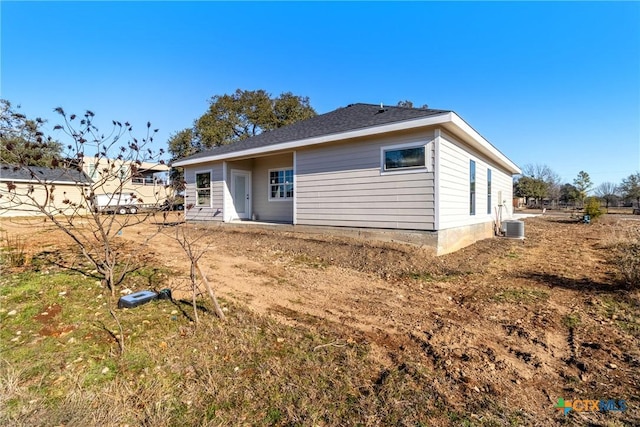 back of house featuring cooling unit