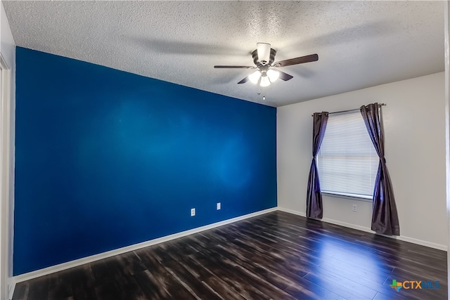 unfurnished room featuring dark hardwood / wood-style flooring, a textured ceiling, and ceiling fan