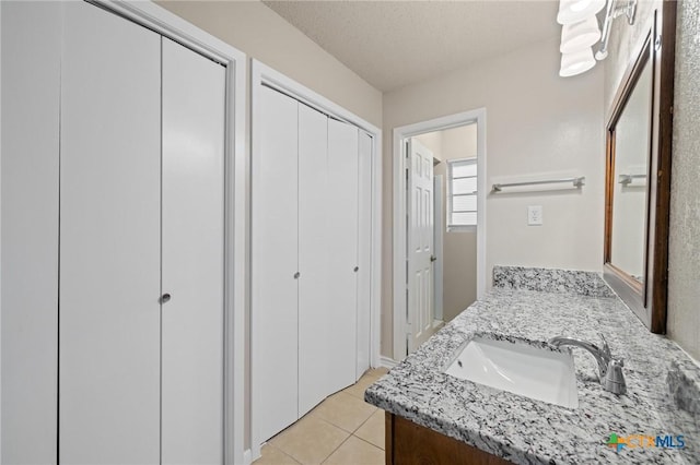 bathroom featuring vanity and tile patterned floors