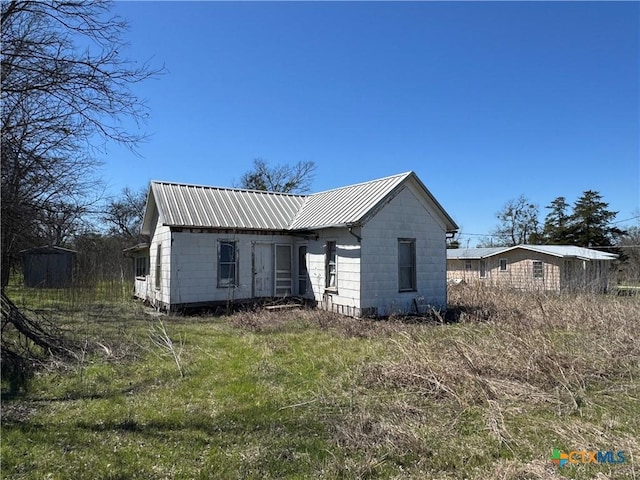 exterior space with metal roof