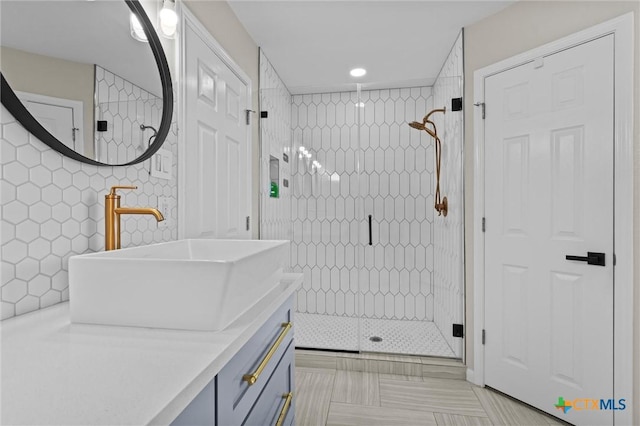 full bath with vanity, a shower stall, and recessed lighting