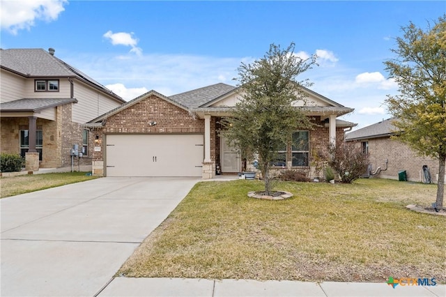 view of front of house with a front lawn and a garage