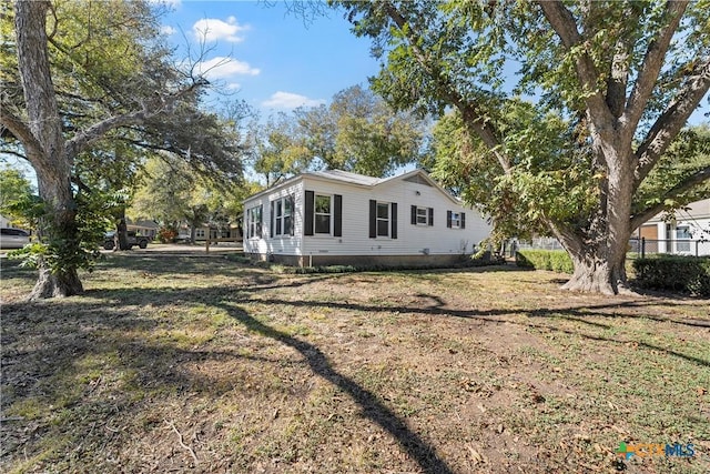 view of home's exterior featuring a yard