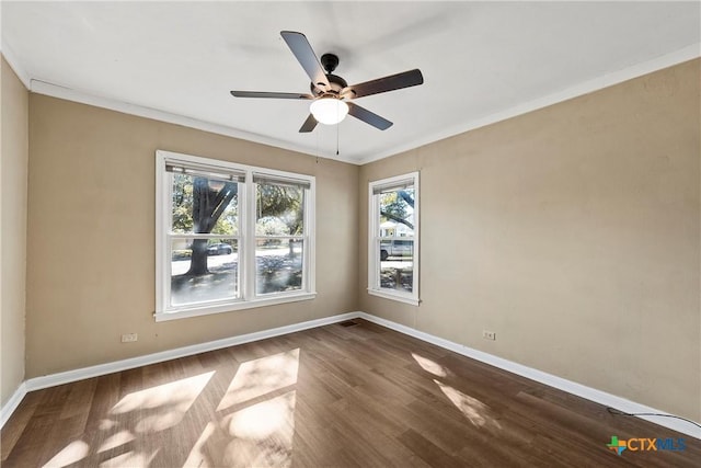 unfurnished room featuring hardwood / wood-style flooring, ceiling fan, and ornamental molding