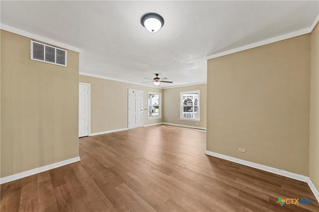 unfurnished living room featuring ceiling fan, wood-type flooring, and crown molding