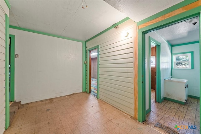 unfurnished room featuring sink