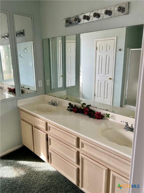 full bathroom featuring double vanity and a sink