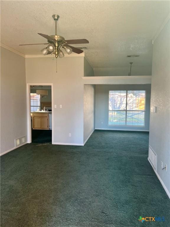 unfurnished living room featuring crown molding, visible vents, dark carpet, and a textured ceiling