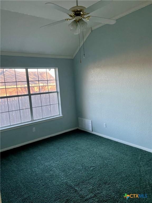 carpeted empty room featuring a ceiling fan, lofted ceiling, visible vents, and baseboards