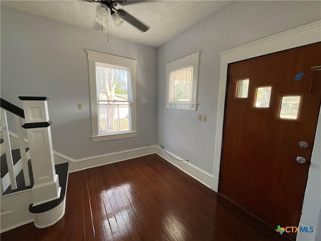 1203 E Third St, Hallettsville, TX 77954 - foyer entrance featuring ceiling fan, hardwood / wood-style flooring, baseboards, and stairs