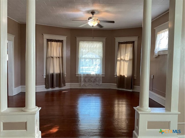 1203 E Third St, Hallettsville, TX 77954 - entryway with decorative columns, a ceiling fan, and hardwood / wood-style flooring