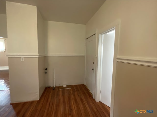 laundry room featuring dark wood-type flooring