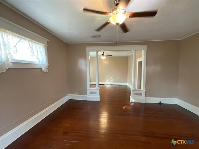 1203 E Third St, Hallettsville, TX 77954 - unfurnished room featuring ceiling fan, hardwood / wood-style floors, baseboards, and decorative columns