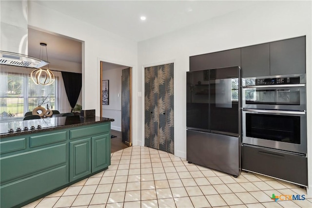 2406 Northwoods Dr, New Braunfels, TX 78132 - kitchen with freestanding refrigerator, stainless steel double oven, island exhaust hood, dark countertops, and a chandelier