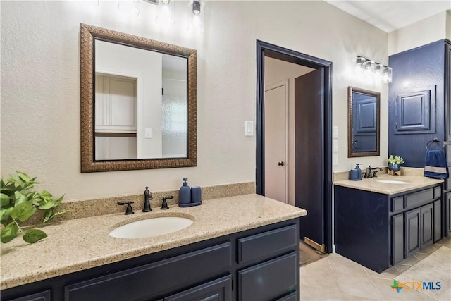 2406 Northwoods Dr, New Braunfels, TX 78132 - bathroom with two vanities and tile patterned floors