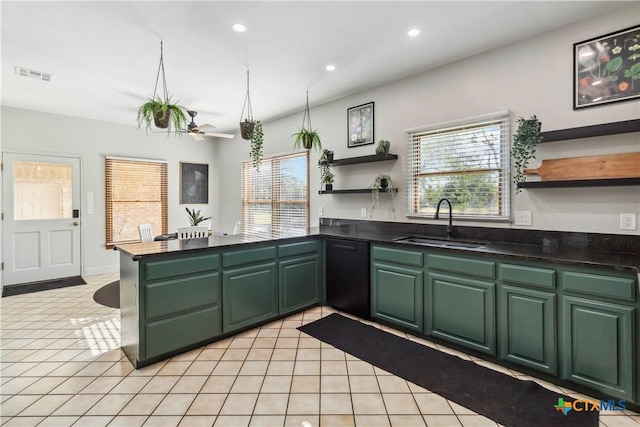 2406 Northwoods Dr, New Braunfels, TX 78132 - kitchen with open shelves, black dishwasher, green cabinets, and recessed lighting