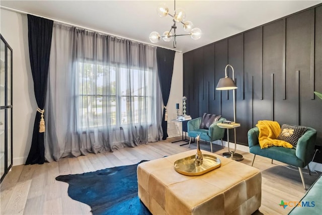 2406 Northwoods Dr, New Braunfels, TX 78132 - living area with light wood-style flooring and a chandelier